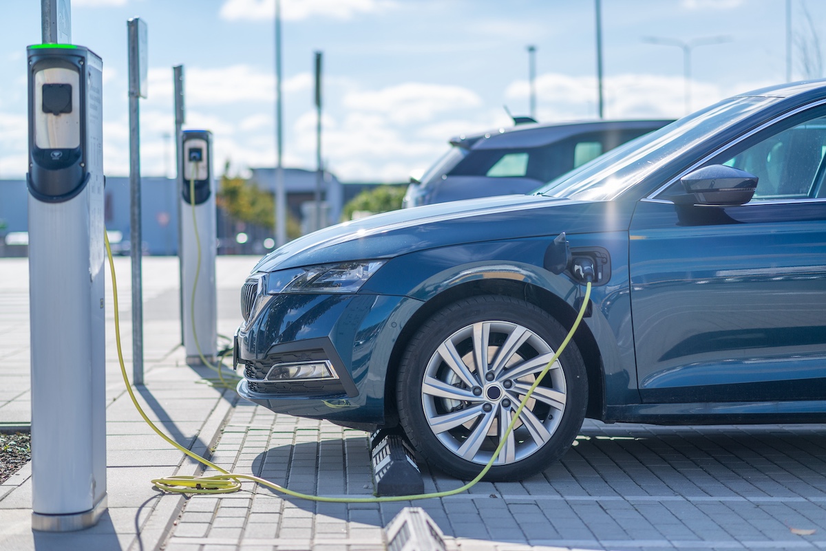 Electric car charging at station