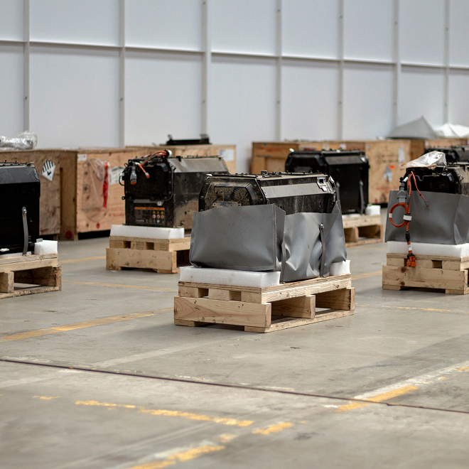 EV battery warehouse with equipment on pallets