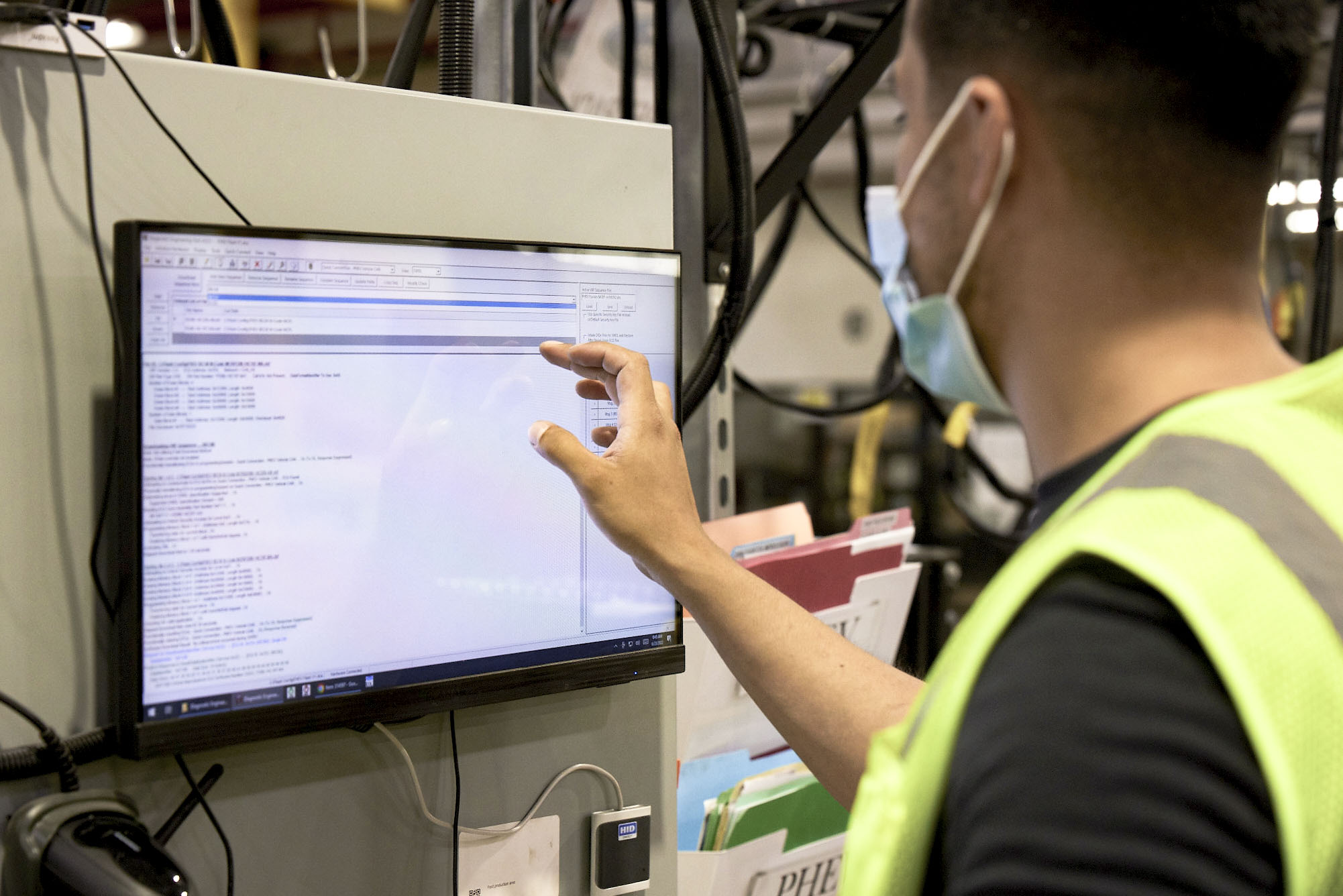 An EVBS team member working on a computer.